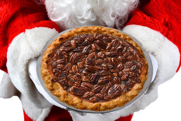 Santa Claus holding pecan pie for christmas